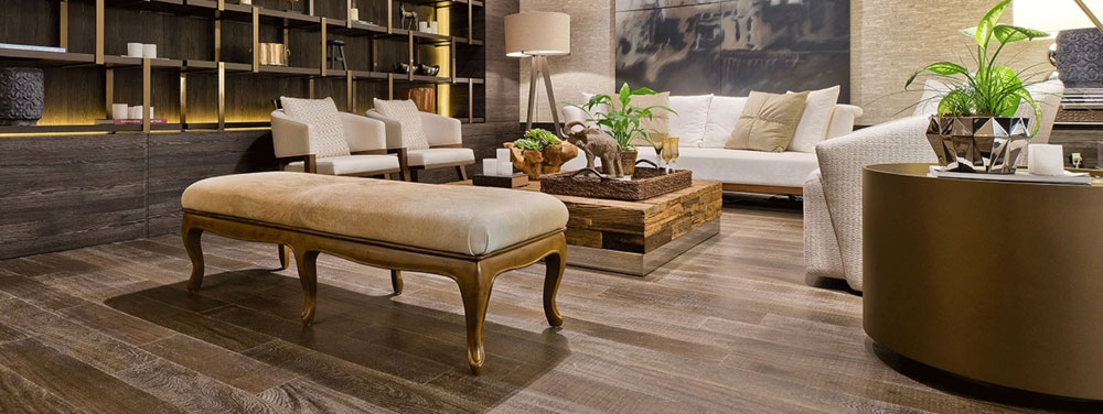 hardwood flooring in upscale living room with plants and bronze accents